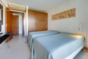 Uma cama ou camas num quarto em Herdade dos Salgados