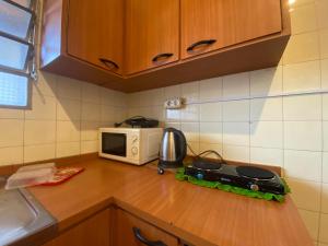 Una cocina o kitchenette en Villa Morra house III