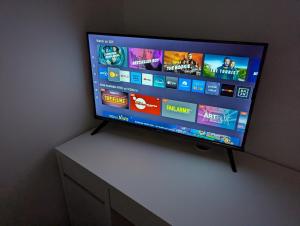 a flat screen tv sitting on top of a table at Budget Zimmer im Siebengebirge in Königswinter
