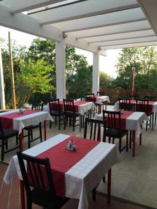 a group of tables and chairs on a patio at Hotel Ruža in Novi Vinodolski