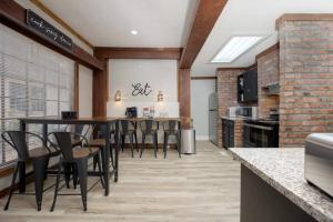 a kitchen and dining room with a table and chairs at Downtown Family Retreat,15 mins to Fort Benning in Columbus