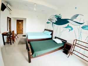 Postel nebo postele na pokoji v ubytování Baden Beach Hotel