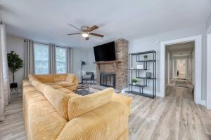 a living room with a couch and a fireplace at Downtown Family Retreat,15 mins to Fort Benning in Columbus