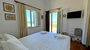 Tempat tidur dalam kamar di Lighthouse View Maisonette