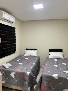 Postel nebo postele na pokoji v ubytování Casa Km2 Petrolina-PE