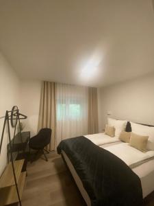 Ένα ή περισσότερα κρεβάτια σε δωμάτιο στο 6 Zimmer Apartment Baden-Baden