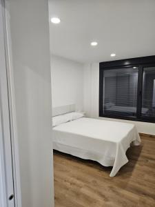 Una cama o camas en una habitación de El Gabal