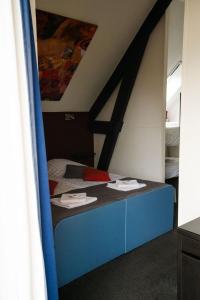 Letto o letti in una camera di Hotel Orion
