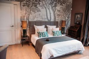 Postel nebo postele na pokoji v ubytování B&B Maison Mairie Hasselt