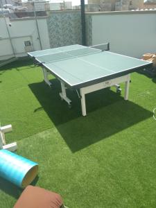 a ping pong table sitting on top of grass at Il Cuore di Trapani in Trapani