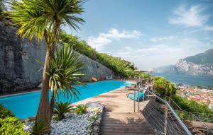a pool with a view of the amalfi coast at Garda Hotel Forte Charme in Nago-Torbole