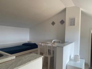 Postel nebo postele na pokoji v ubytování Residence Calavà