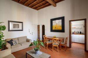 a living room with a couch and a table at The Right Place 4U Quercia Apartment in Rome +20 photos