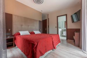Ein Bett oder Betten in einem Zimmer der Unterkunft Hotel de La Trucha