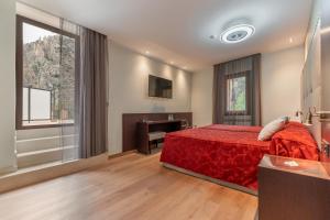 Ein Bett oder Betten in einem Zimmer der Unterkunft Hotel de La Trucha