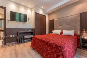 Ein Bett oder Betten in einem Zimmer der Unterkunft Hotel de La Trucha