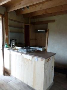 a kitchen with a counter top in a room at Maison en éco construction in Piégros-la-Clastre