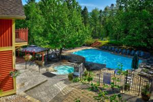 an overhead view of a swimming pool in a yard at Tremblant Les Eaux D - Mont-Tremblant in Mont-Tremblant