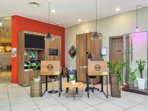 A television and/or entertainment centre at B&B Hotel Milano-Monza