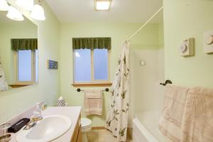 a bathroom with a sink and a shower at Cave Bay Vacation Rental with Game Room! in Worley +23 photos