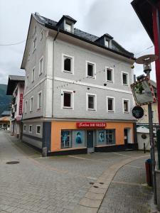 a large building on the side of a street at Ferienwohnungen Meier in Ebensee