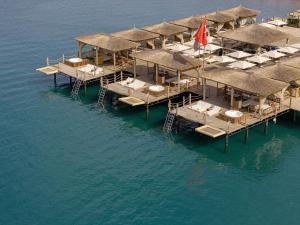 an aerial view of a row of docks in the water at Titanic Deluxe Lara in Lara