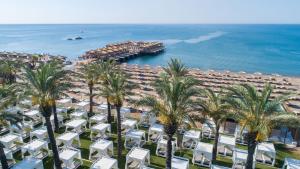 an aerial view of a resort with palm trees and the ocean at Titanic Deluxe Lara in Lara