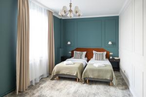 Posteľ alebo postele v izbe v ubytovaní Hotel Mały Młyn + 37 fotografií