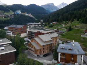 an aerial view of a town in the mountains at Duplex plein sud à Courchevel Village - 4 pers - Pieds des pistes, balcons, parking, casier à skis - FR-1-631-73 in Courchevel