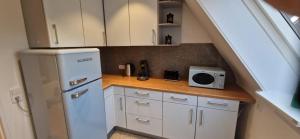 Kuchyň nebo kuchyňský kout v ubytování Renatas Ferienwohnung ISABEL