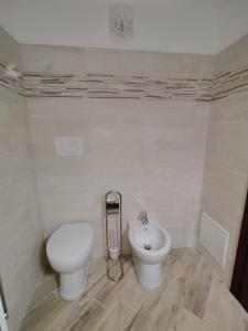 a bathroom with a toilet and a sink at Agriturismo Donna Bianca in Mormanno +71 photos