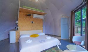 Postel nebo postele na pokoji v ubytování Ajara Glamping Kokotauri