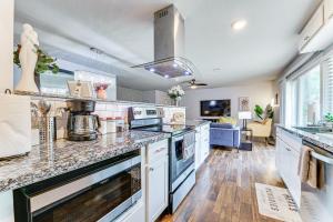 a kitchen with a counter top and a stove top oven at Near Lewisville Lake Home in The Colony with Yard! in The Colony