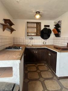 a kitchen with a sink and a counter top at Casa Porfirio y Cristina in Pedro Álvarez
