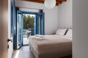 Postel nebo postele na pokoji v ubytování Aegean Seasons