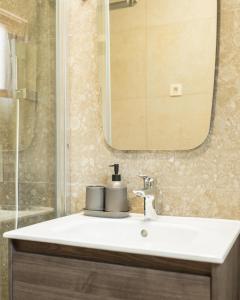 a bathroom with a sink and a mirror at Bradasevic Apart Resort Tivat lux in Tivat +107 photos