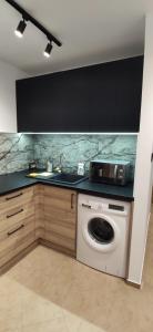 Kuchyňa alebo kuchynka v ubytovaní Apartment Jerzmanowskiego Krakow