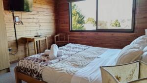 Postel nebo postele na pokoji v ubytování Alpes Hotel