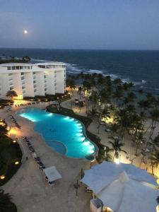 a view of a resort with a pool and the ocean at Marbella AquaVista 11-18 in Juan Pedro