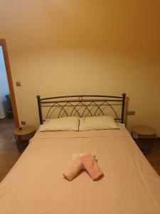 a bedroom with a bed with a towel on it at marina in Dhidhimótikhon