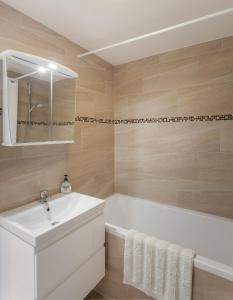 Koupelna v ubytování Lakeview Apartments Bled + 23 fotografií