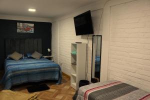 Cama ou camas em um quarto em Hostal Familiar S&G