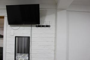 Uma TV ou centro de entretenimento em Hostal Familiar S&G