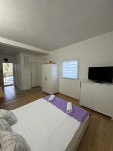 Ένα ή περισσότερα κρεβάτια σε δωμάτιο στο Studio Apartment