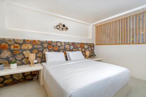 Voodi või voodid majutusasutuse Eolithos Exclusive Suites toas