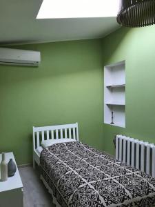 Postel nebo postele na pokoji v ubytování Aeru residence