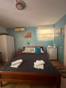 Postel nebo postele na pokoji v ubytování ASTAKOS apartments Budva