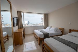 Postel nebo postele na pokoji v ubytování Hotel Stil Cartagena