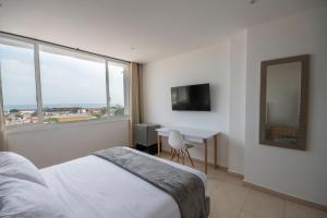 TV a/nebo společenská místnost v ubytování Hotel Stil Cartagena
