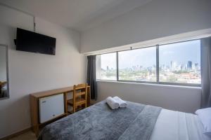Postel nebo postele na pokoji v ubytování Hotel Stil Cartagena